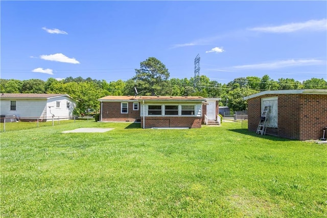1204 Blythewood Ln, Suffolk, VA 23434 - back of property featuring brick siding and an outbuilding