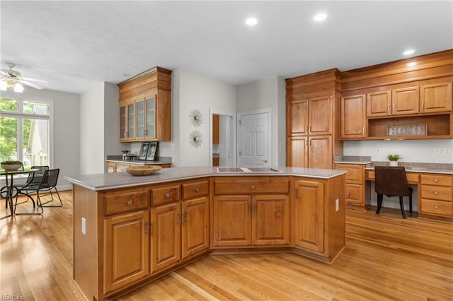 118 Goose Hill Way, Smithfield, VA 23430 - kitchen featuring a kitchen island, light wood-style floors, open shelves, recessed lighting, and glass insert cabinets