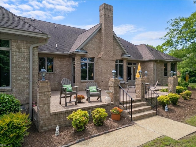 118 Goose Hill Way, Smithfield, VA 23430 - back of property with a patio, a chimney, brick siding, and a shingled roof