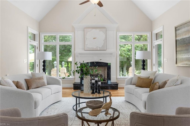 118 Goose Hill Way, Smithfield, VA 23430 - living room with a ceiling fan, a fireplace with raised hearth, light wood finished floors, and high vaulted ceiling