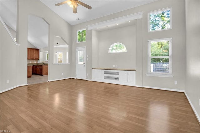 1300 Equinox Lndg, Chesapeake, VA 23322 - unfurnished living room featuring high vaulted ceiling, ceiling fan, light wood-style flooring, and baseboards