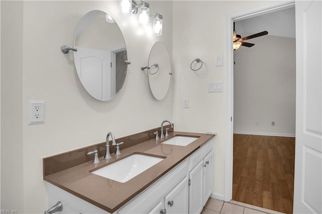 1300 Equinox Lndg, Chesapeake, VA 23322 - bathroom with double vanity, baseboards, a ceiling fan, and wood finished floors
