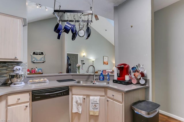 321 Duke St Unit 133, Norfolk, VA 23510 - kitchen featuring stainless steel dishwasher, a sink, light brown cabinetry, vaulted ceiling, and a peninsula