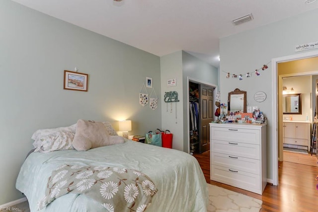 321 Duke St Unit 133, Norfolk, VA 23510 - bedroom with wood finished floors, a closet, and baseboards