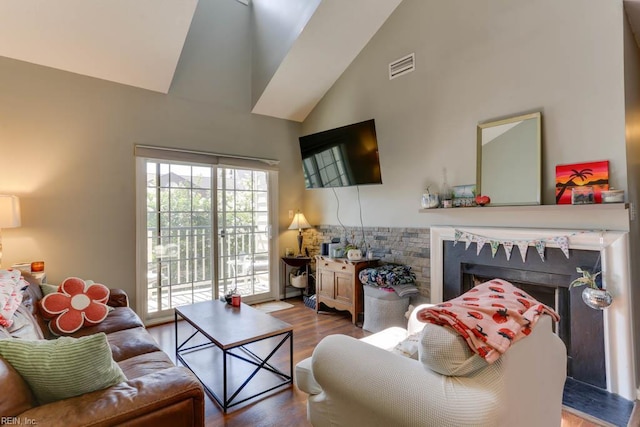 321 Duke St Unit 133, Norfolk, VA 23510 - living area with high vaulted ceiling, wood finished floors, and a fireplace