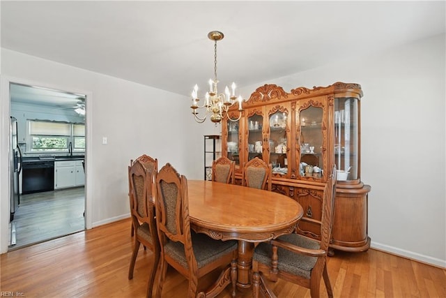 355 Nassau Pl, Hampton, VA 23666 - dining room with a chandelier, light wood-style flooring, and baseboards
