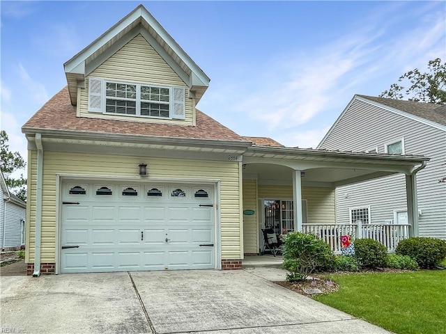 2884 Einstein Dr, Virginia Beach, VA 23456 - view of front of property featuring a porch, concrete driveway, a garage, and a shingled roof