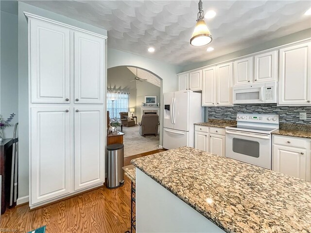 2884 Einstein Dr, Virginia Beach, VA 23456 - kitchen featuring white appliances, wood finished floors, ceiling fan, white cabinets, and dark stone countertops