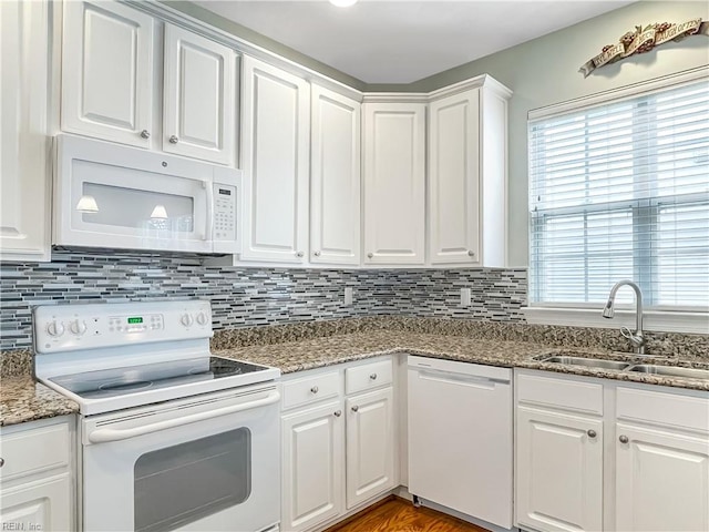 2884 Einstein Dr, Virginia Beach, VA 23456 - kitchen with white appliances, a sink, healthy amount of natural light, and white cabinetry