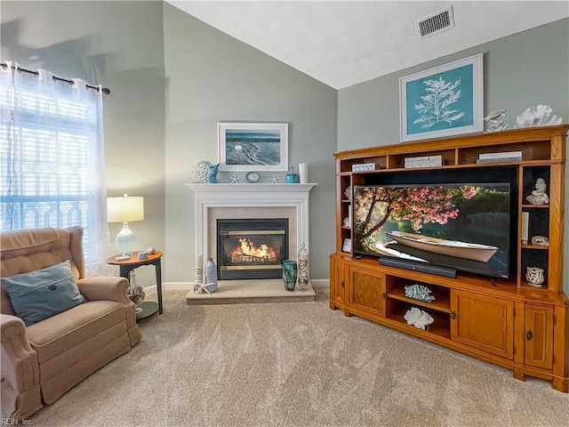 2884 Einstein Dr, Virginia Beach, VA 23456 - living room featuring carpet flooring, lofted ceiling, a glass covered fireplace, and baseboards