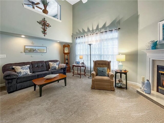 2884 Einstein Dr, Virginia Beach, VA 23456 - living room with carpet flooring, a glass covered fireplace, baseboards, and a high ceiling