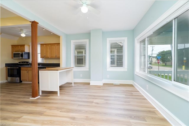 319 N First St, Hampton, VA 23664 - kitchen featuring stainless steel appliances, a ceiling fan, baseboards, and light wood-style flooring
