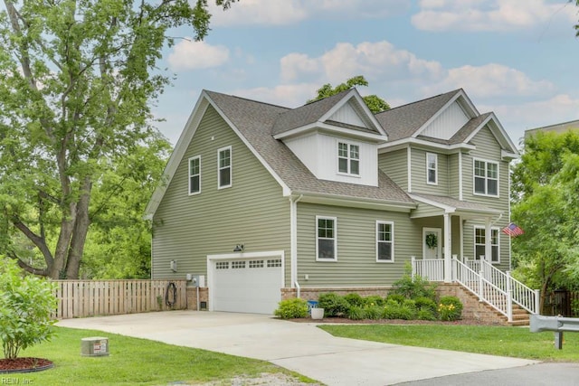 7412 Glenroie Ave, Norfolk, VA 23505 - view of front of home featuring a garage, a shingled roof, and driveway
