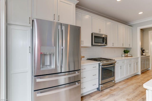 7412 Glenroie Ave, Norfolk, VA 23505 - kitchen with stainless steel appliances, light countertops, crown molding, tasteful backsplash, and white cabinetry