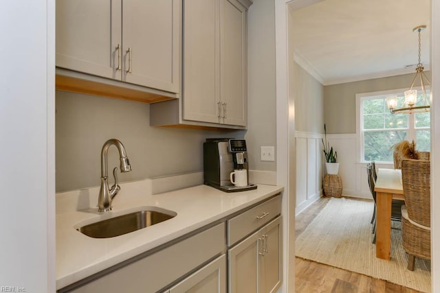 7412 Glenroie Ave, Norfolk, VA 23505 - kitchen with a sink, gray cabinetry, light countertops, a chandelier, and ornamental molding