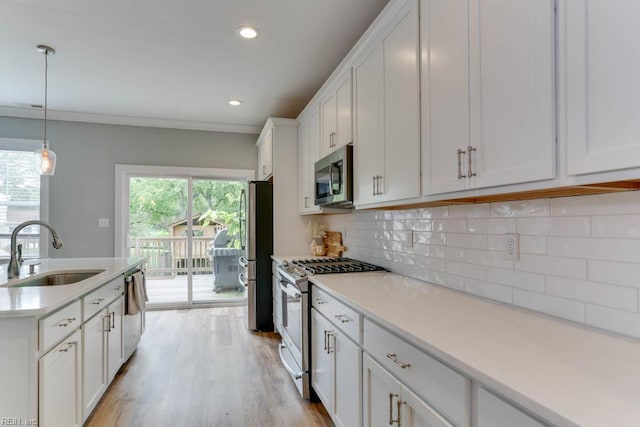 7412 Glenroie Ave, Norfolk, VA 23505 - kitchen featuring stainless steel appliances, a sink, white cabinetry, light countertops, and recessed lighting