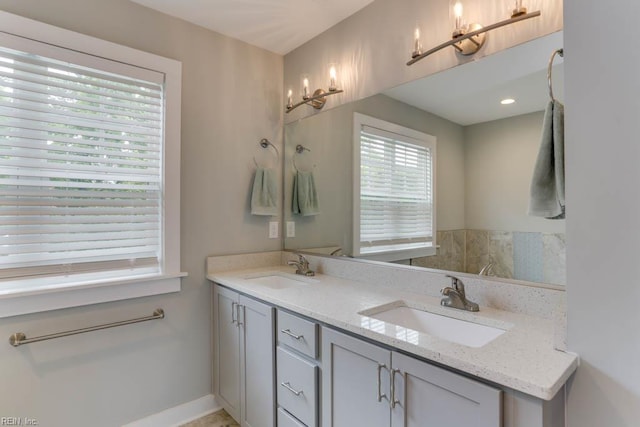 7412 Glenroie Ave, Norfolk, VA 23505 - bathroom featuring double vanity, a chandelier, and baseboards