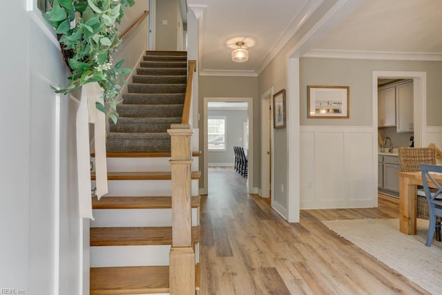 7412 Glenroie Ave, Norfolk, VA 23505 - stairs with ornamental molding, wood finished floors, a wainscoted wall, and a decorative wall