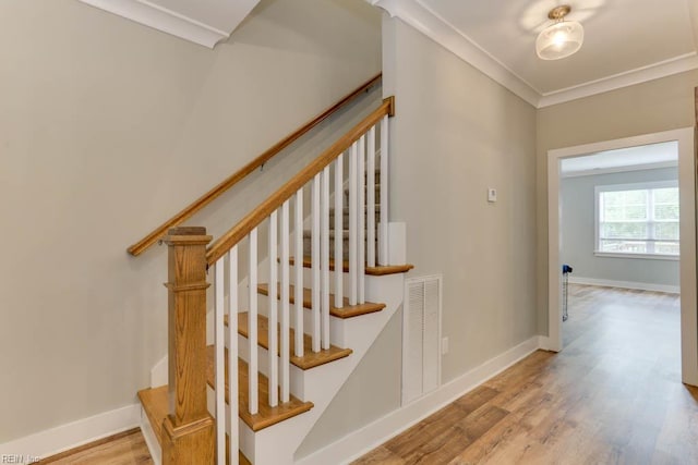 7412 Glenroie Ave, Norfolk, VA 23505 - staircase with wood finished floors, baseboards, and crown molding