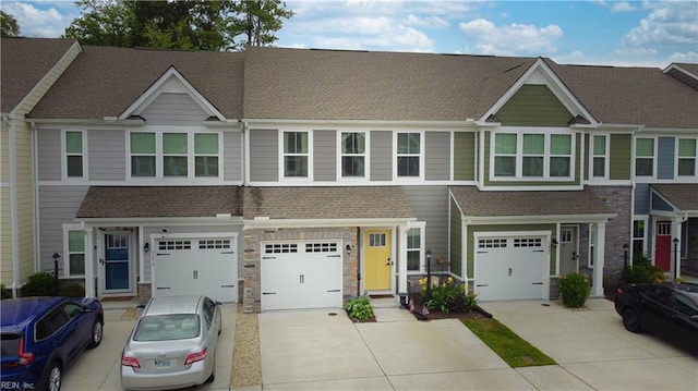 1621 Redwing Arch, Chesapeake, VA 23323 - townhome / multi-family property with driveway, roof with shingles, and a garage