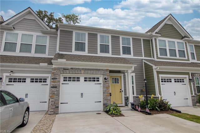 1621 Redwing Arch, Chesapeake, VA 23323 - townhome / multi-family property with a garage, driveway, stone siding, and a shingled roof