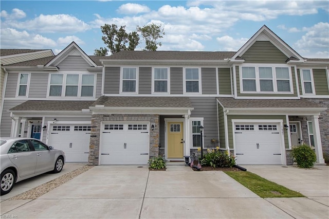 1621 Redwing Arch, Chesapeake, VA 23323 - townhome / multi-family property with driveway, a garage, stone siding, and a shingled roof