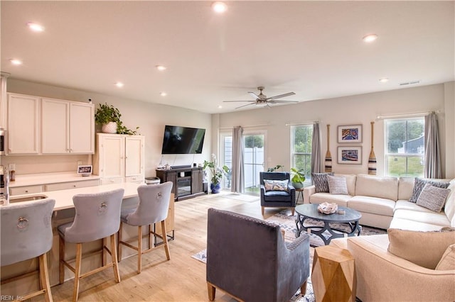 1621 Redwing Arch, Chesapeake, VA 23323 - living room featuring healthy amount of natural light, recessed lighting, a ceiling fan, light wood-type flooring, and a fireplace