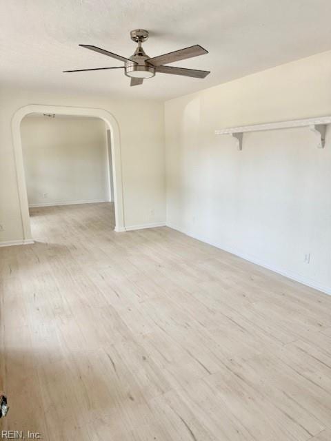 291 Fair Meadows Rd, Virginia Beach, VA 23462 - unfurnished room with arched walkways, a ceiling fan, light wood-type flooring, and baseboards