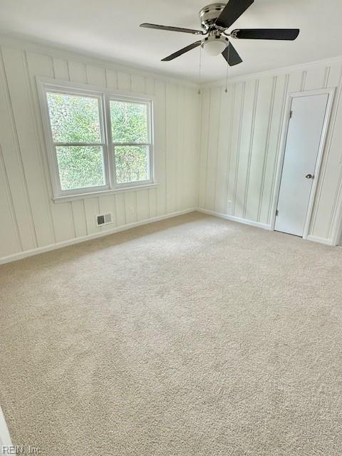 291 Fair Meadows Rd, Virginia Beach, VA 23462 - empty room with light carpet, a ceiling fan, and a decorative wall