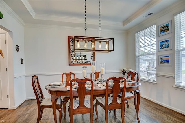 3729 Longhill Arch, Chesapeake, VA 23323 - dining area with healthy amount of natural light, wood finished floors, ornamental molding, and a raised ceiling