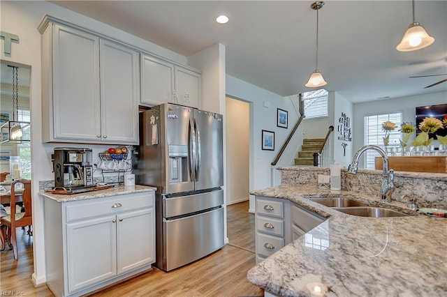 3729 Longhill Arch, Chesapeake, VA 23323 - kitchen featuring stainless steel fridge, a sink, light wood-style flooring, light stone counters, and recessed lighting