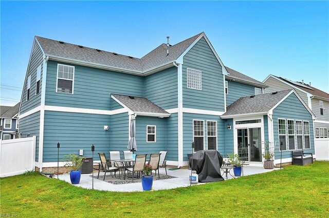 3729 Longhill Arch, Chesapeake, VA 23323 - back of house featuring a patio, a sunroom, and a shingled roof