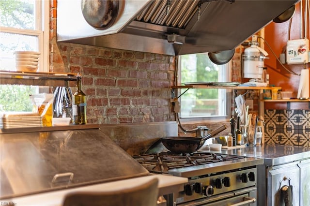 1231 Boissevain Ave, Norfolk, VA 23507 - kitchen with stainless steel countertops, plenty of natural light, tasteful backsplash, and stainless steel stove