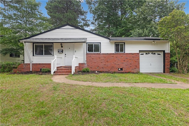 2720 Juniper St, Norfolk, VA 23513 - view of front of home with brick siding, a garage, and a front lawn