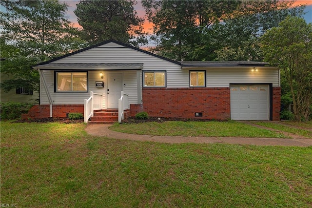 2720 Juniper St, Norfolk, VA 23513 - view of front facade with a garage, brick siding, and a front yard