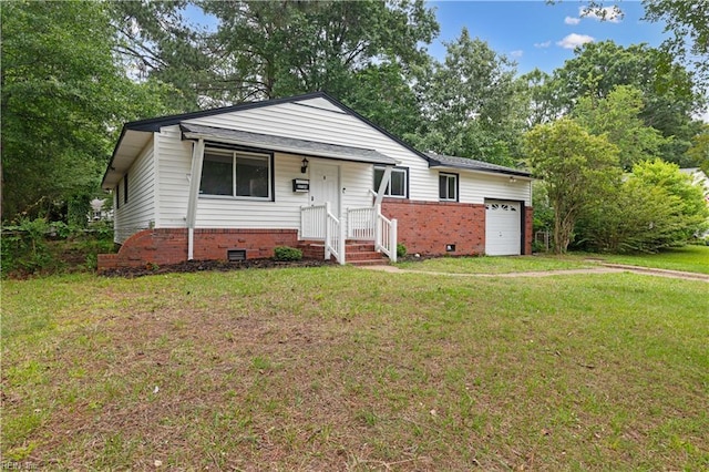 2720 Juniper St, Norfolk, VA 23513 - view of front of home featuring a front yard, crawl space, brick siding, a garage, and view of wooded area