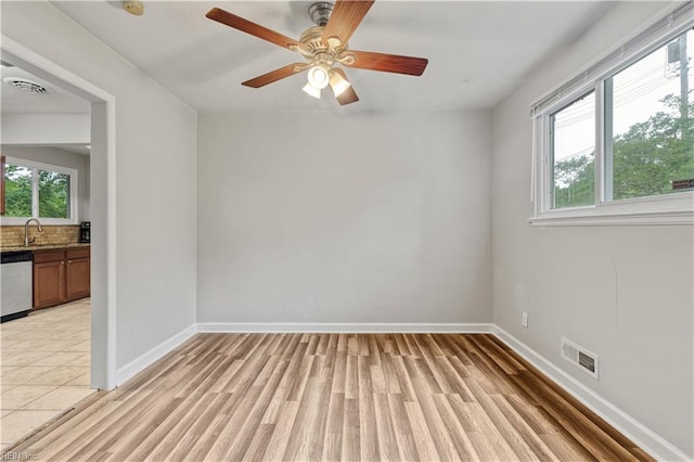 2720 Juniper St, Norfolk, VA 23513 - unfurnished room with light wood-type flooring, baseboards, and a ceiling fan