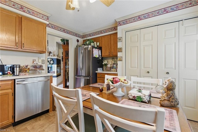 104 Pheasant Watch, Yorktown, VA 23692 - kitchen with stainless steel appliances, light countertops, brown cabinets, and a ceiling fan