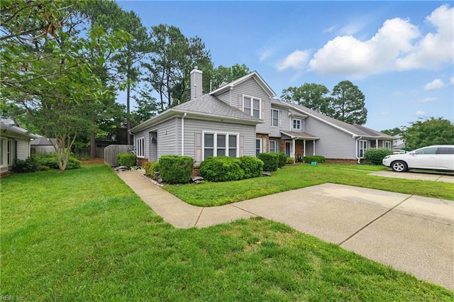 104 Pheasant Watch, Yorktown, VA 23692 - traditional-style home featuring a chimney, brick siding, and roof with shingles