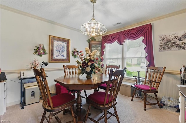 104 Pheasant Watch, Yorktown, VA 23692 - dining area with a chandelier, crown molding, a textured ceiling, and light carpet