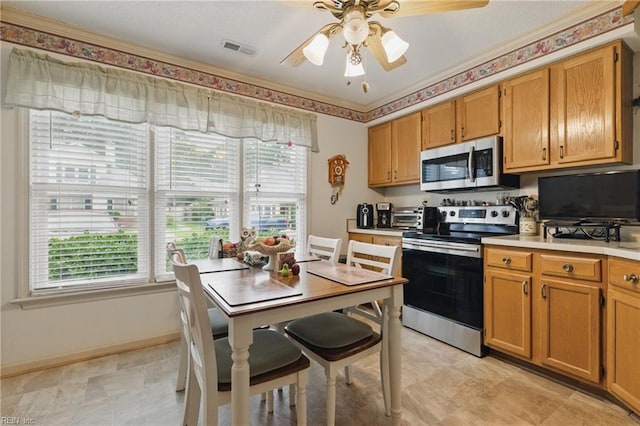 104 Pheasant Watch, Yorktown, VA 23692 - kitchen featuring stainless steel appliances, plenty of natural light, light countertops, and a ceiling fan