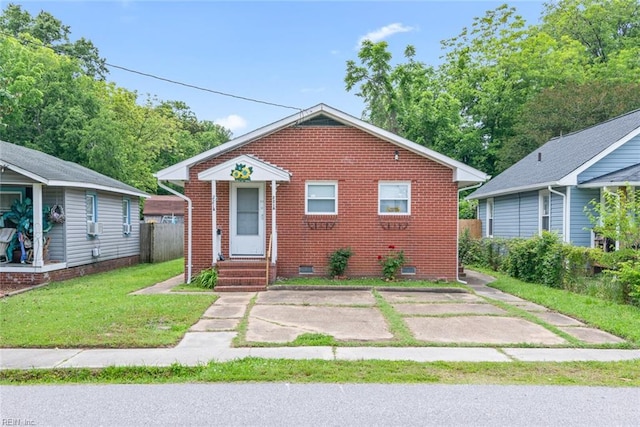 221 Herbert Ave, Hampton, VA 23664 - bungalow with crawl space, brick siding, and a front yard