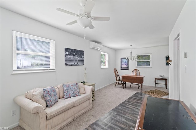 221 Herbert Ave, Hampton, VA 23664 - carpeted living room featuring a wall unit AC, a chandelier, baseboards, and ceiling fan