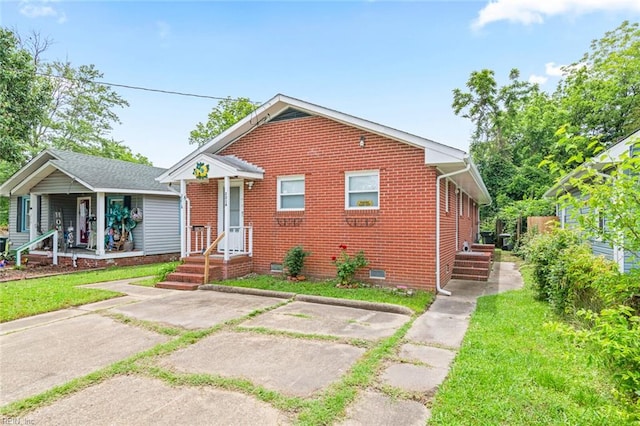 221 Herbert Ave, Hampton, VA 23664 - bungalow with crawl space, brick siding, and a front yard