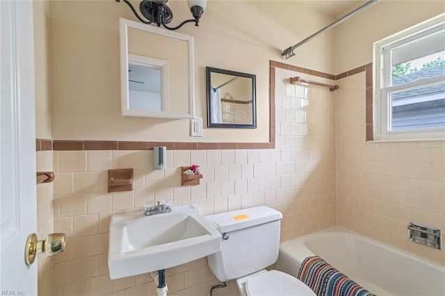 221 Herbert Ave, Hampton, VA 23664 - bathroom with toilet, shower / bath combo with shower curtain, tile walls, and a sink