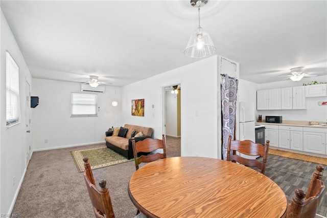221 Herbert Ave, Hampton, VA 23664 - dining space featuring a ceiling fan, baseboards, a wall mounted air conditioner, and light carpet