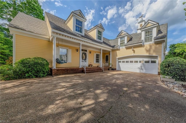 2504 William Tankard Dr, Williamsburg, VA 23185 - cape cod home featuring covered porch, driveway, an attached garage, and a shingled roof