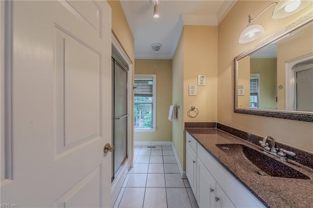 2504 William Tankard Dr, Williamsburg, VA 23185 - bathroom with ornamental molding, vanity, tile patterned floors, an enclosed shower, and baseboards