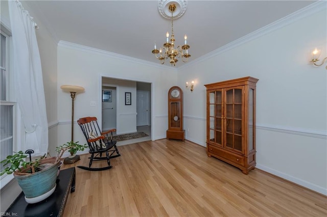 2504 William Tankard Dr, Williamsburg, VA 23185 - sitting room featuring a chandelier, light wood-style flooring, crown molding, and baseboards
