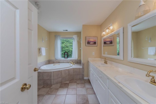 2504 William Tankard Dr, Williamsburg, VA 23185 - bathroom featuring a bath, double vanity, and tile patterned flooring